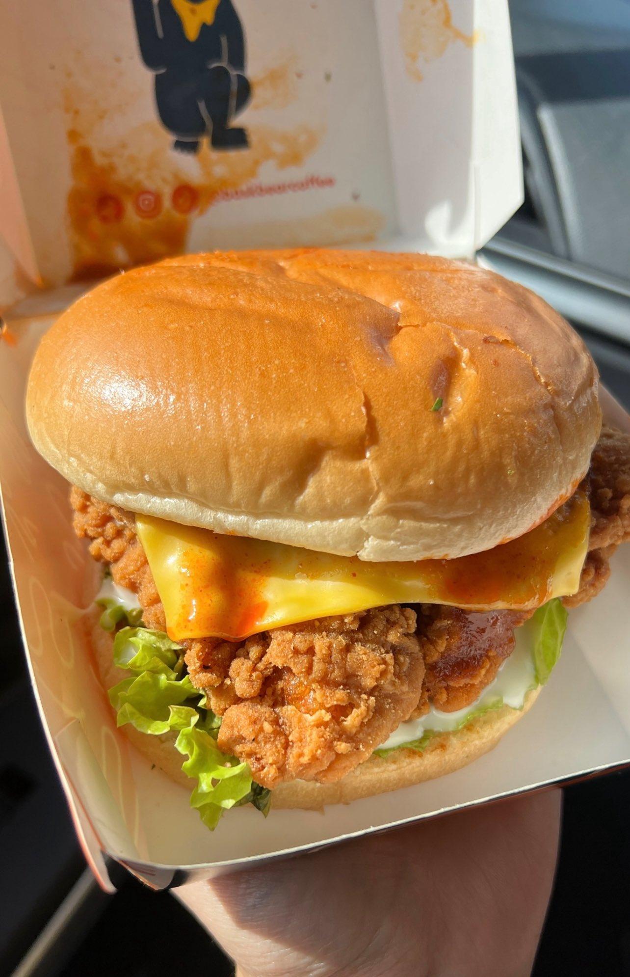 Phone photo of crispy chicken burger before editing